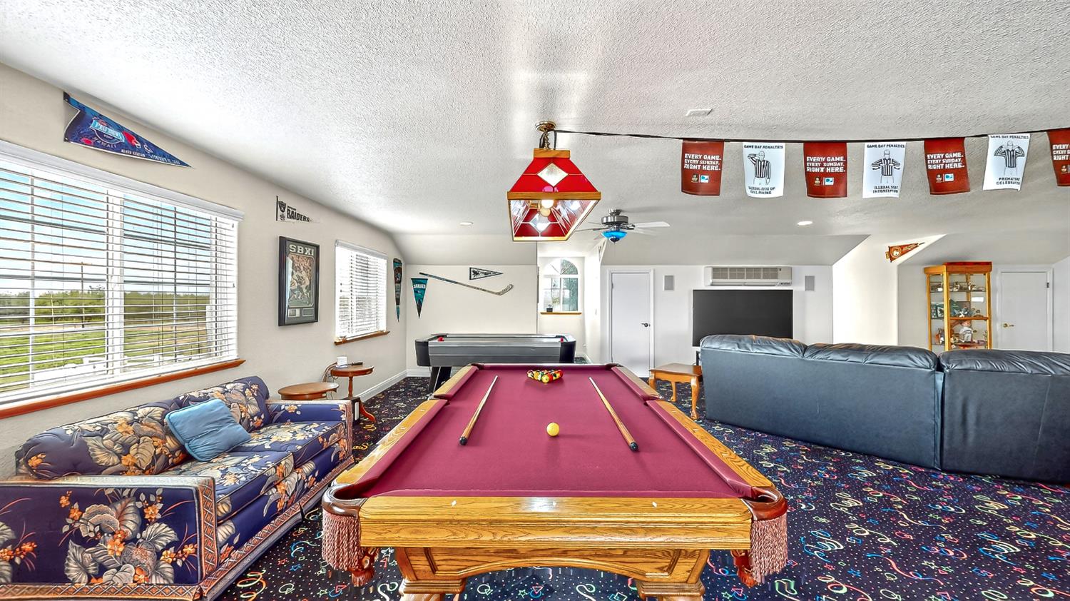 770 Merriam Road Hickman, CA 95323 - Photo 32 of 91 a living room with furniture a rug and a wall painting
