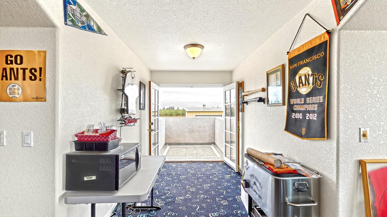 770 Merriam Road Hickman, CA 95323 - Photo 34 of 91 a living room with furniture and a floor to ceiling window