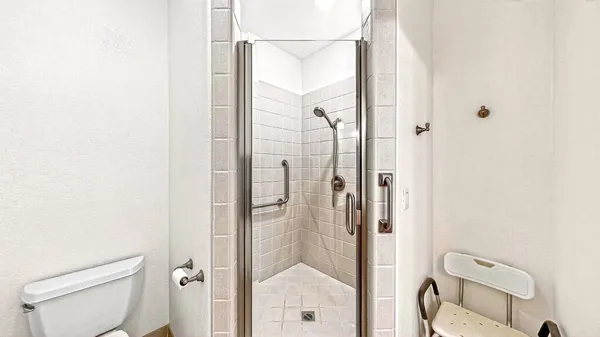 a view of a room with a window and a ceiling fan