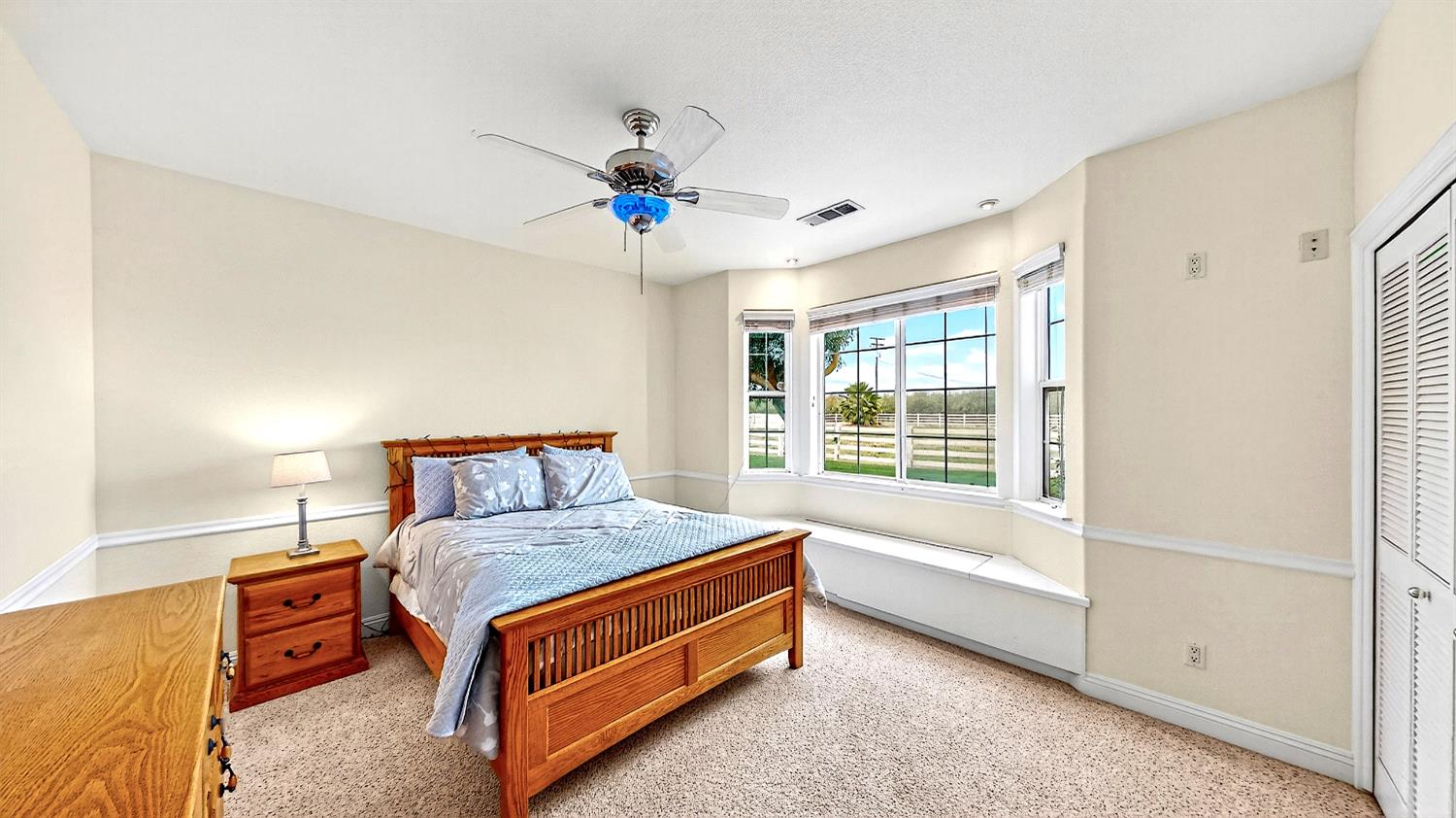 770 Merriam Road Hickman, CA 95323 - Photo 42 of 91 a bedroom with a bed and a chandelier