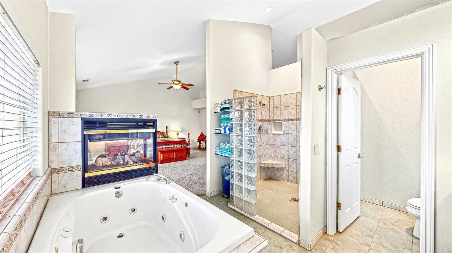 770 Merriam Road Hickman, CA 95323 - Photo 52 of 91 a view of a living room with stainless steel appliances wooden floor and a fireplace