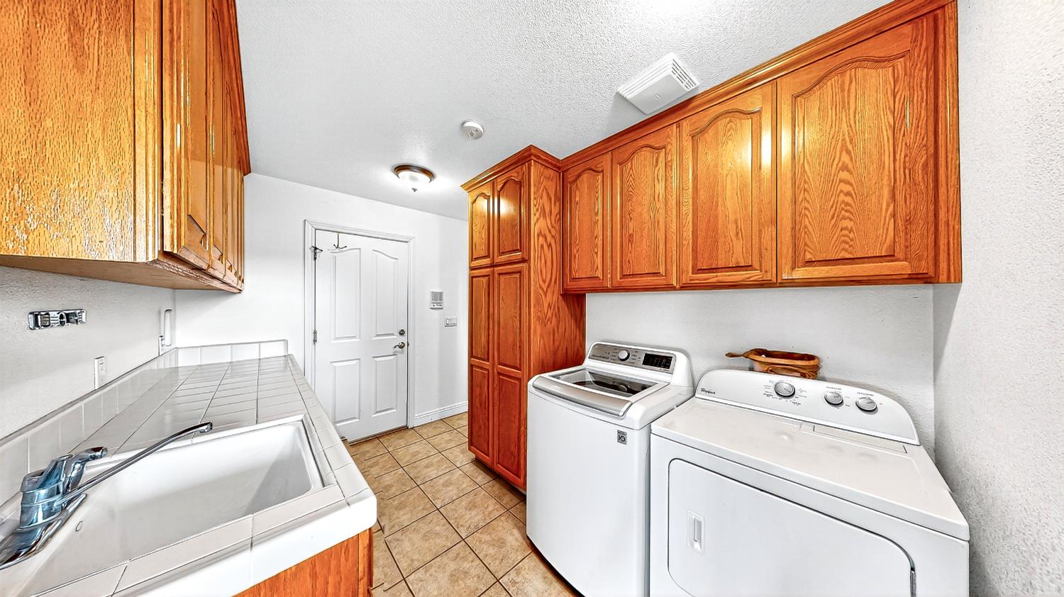 770 Merriam Road Hickman, CA 95323 - Photo 55 of 91 a storage room with washer and dryer