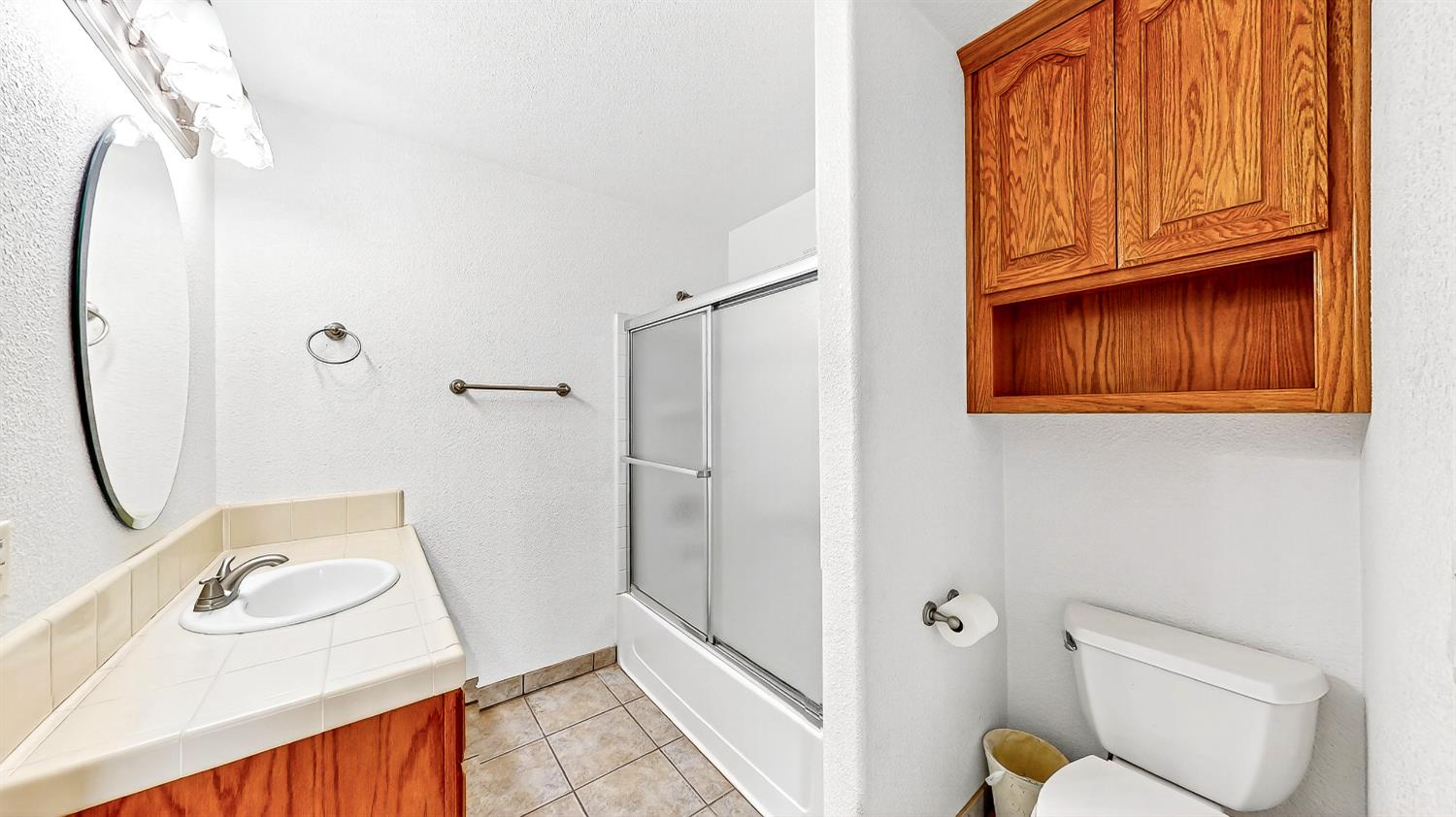 770 Merriam Road Hickman, CA 95323 - Photo 62 of 91 a bathroom with a sink toilet and shower