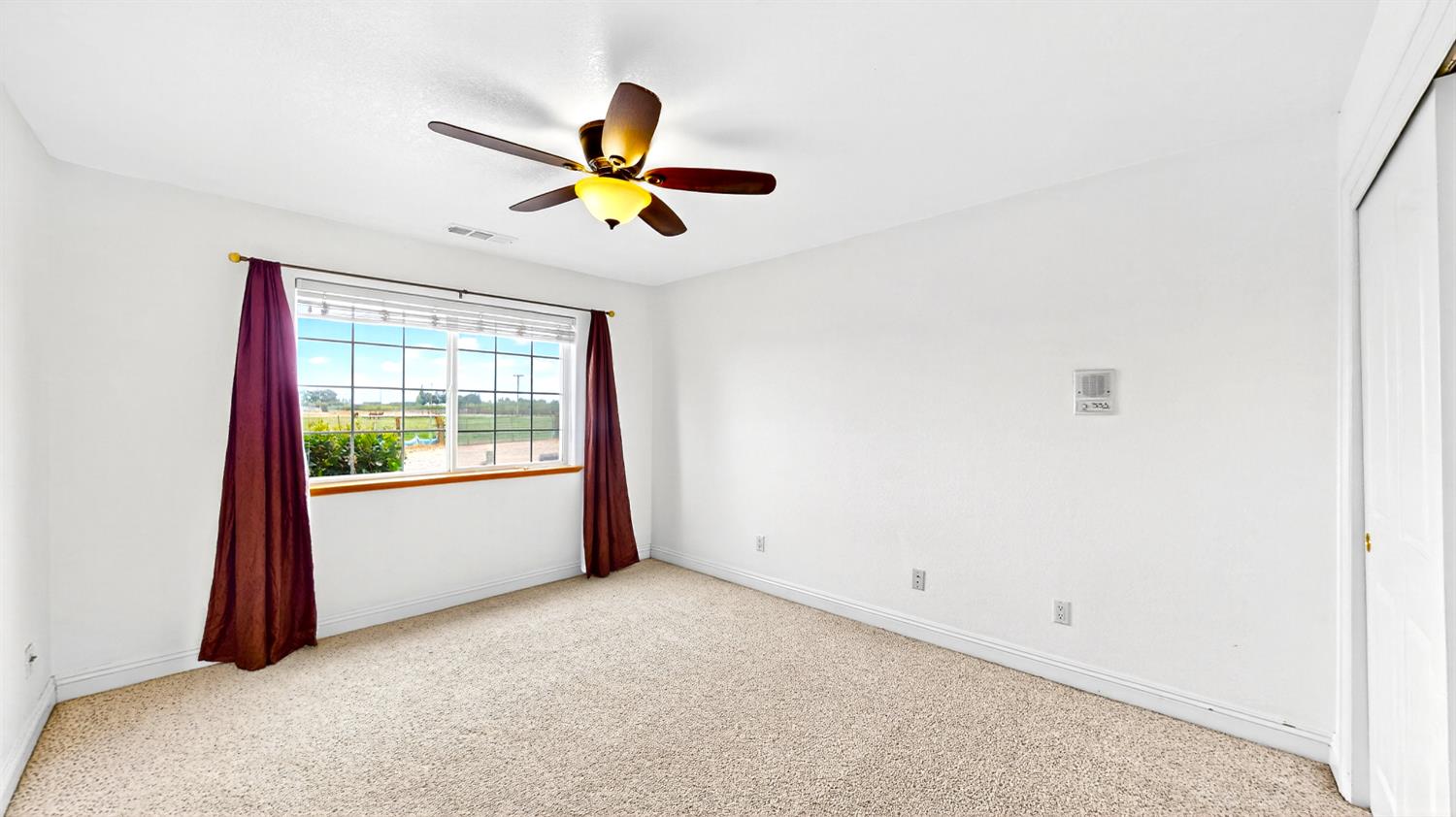 770 Merriam Road Hickman, CA 95323 - Photo 63 of 91 a view of a room with a window and a ceiling fan