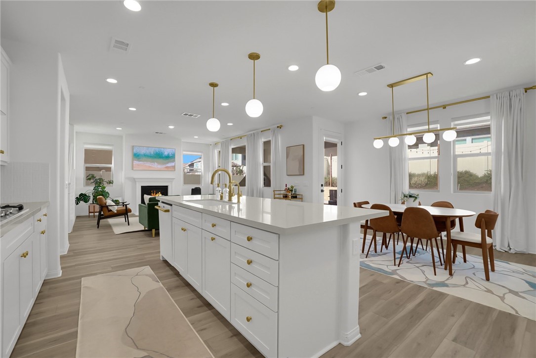 32136 Dymondia Way Temecula, CA 92591 - Photo 12 of 40 a large kitchen with lots of counter space and dining table