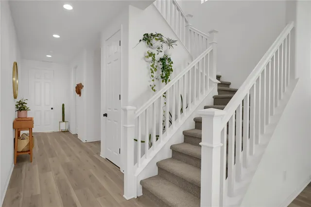 a view of entryway with wooden floor