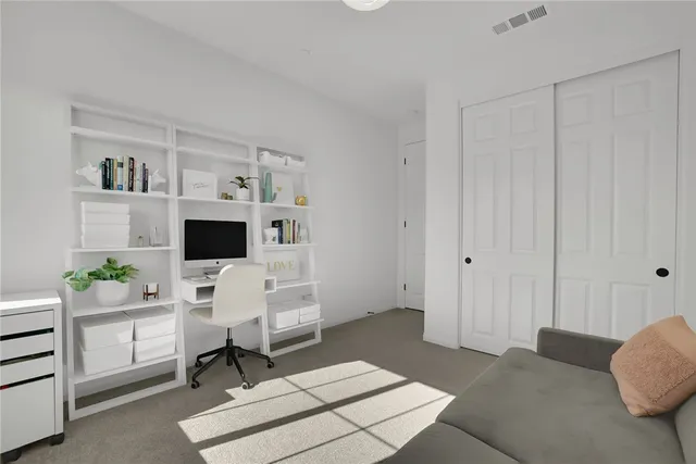 a workspace with furniture and window