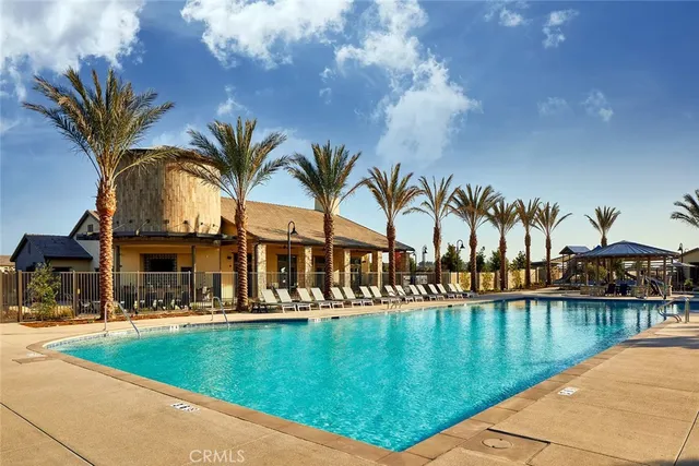 a view of a swimming pool with a garden and plants