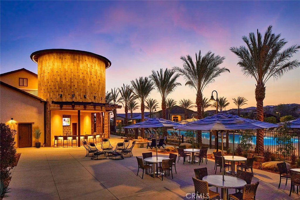 32136 Dymondia Way Temecula, CA 92591 - Photo 40 of 40 a view of a swimming pool with a table and chairs under an umbrella