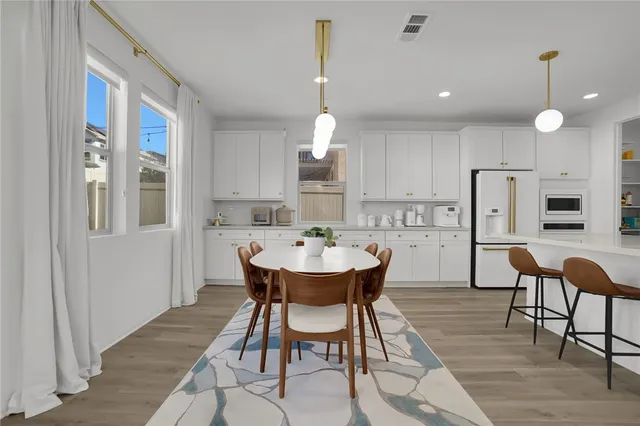 a view of a dining room with furniture and window