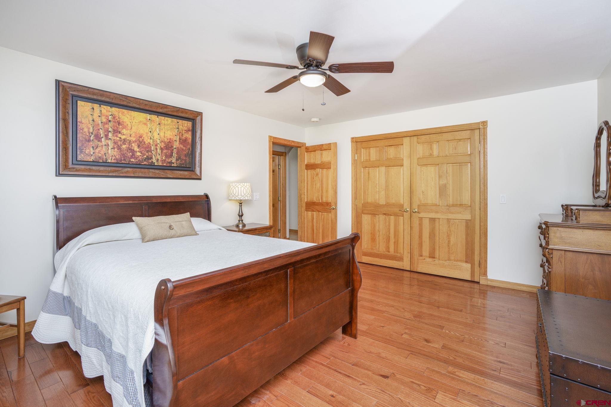 9113 Coogans Bluff Road Austin, CO 81410 - Photo 13 of 22 a bedroom with a bed and wooden floor