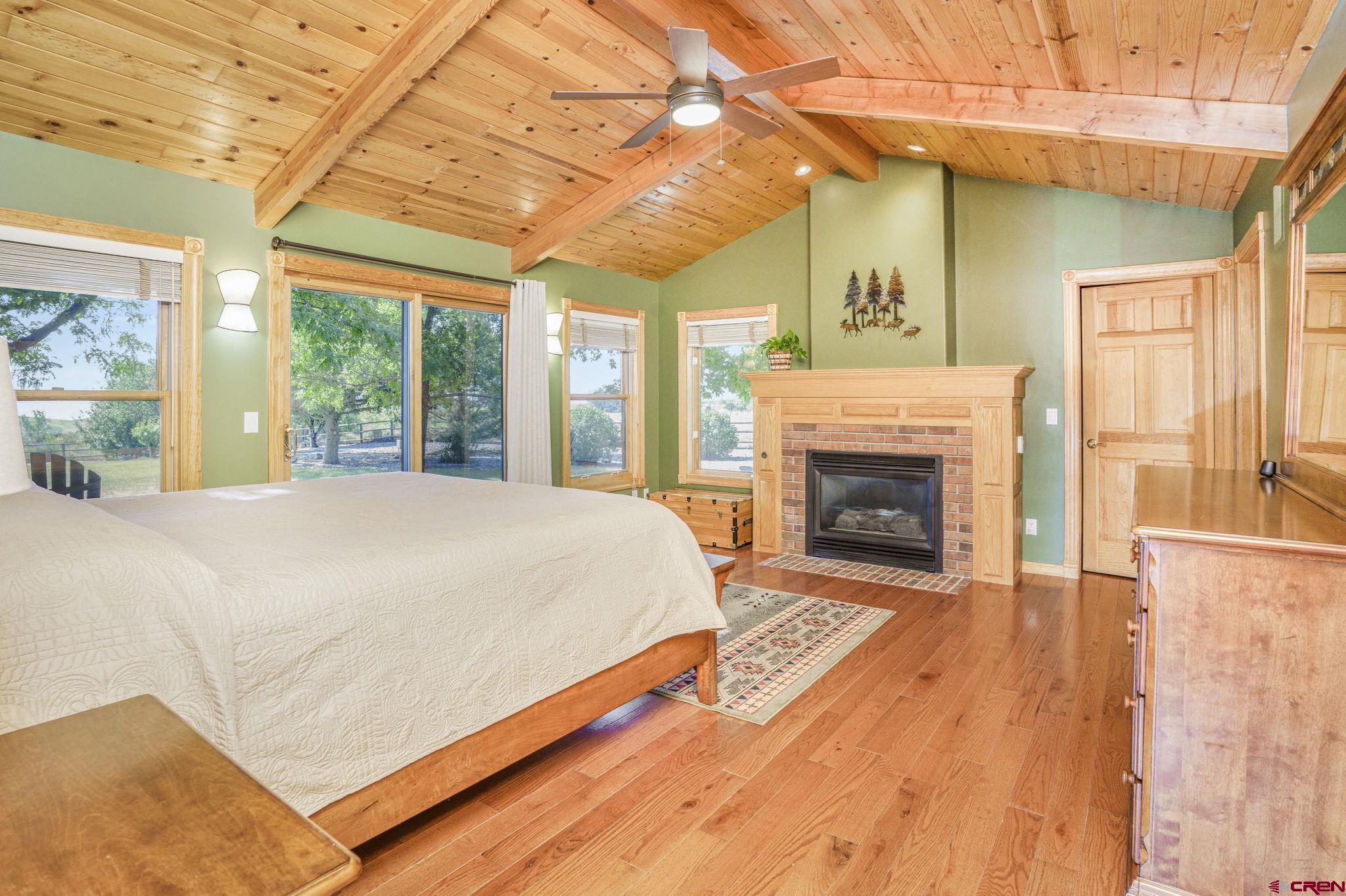 9113 Coogans Bluff Road Austin, CO 81410 - Photo 8 of 22 a bed sitting in a spacious bedroom next to a window