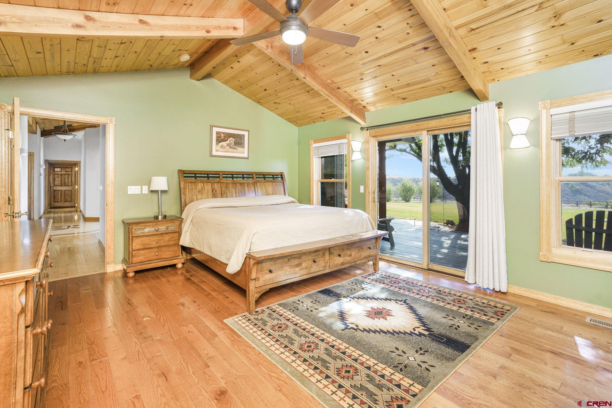 9113 Coogans Bluff Road Austin, CO 81410 - Photo 9 of 22 a bedroom with a bed and wooden floor