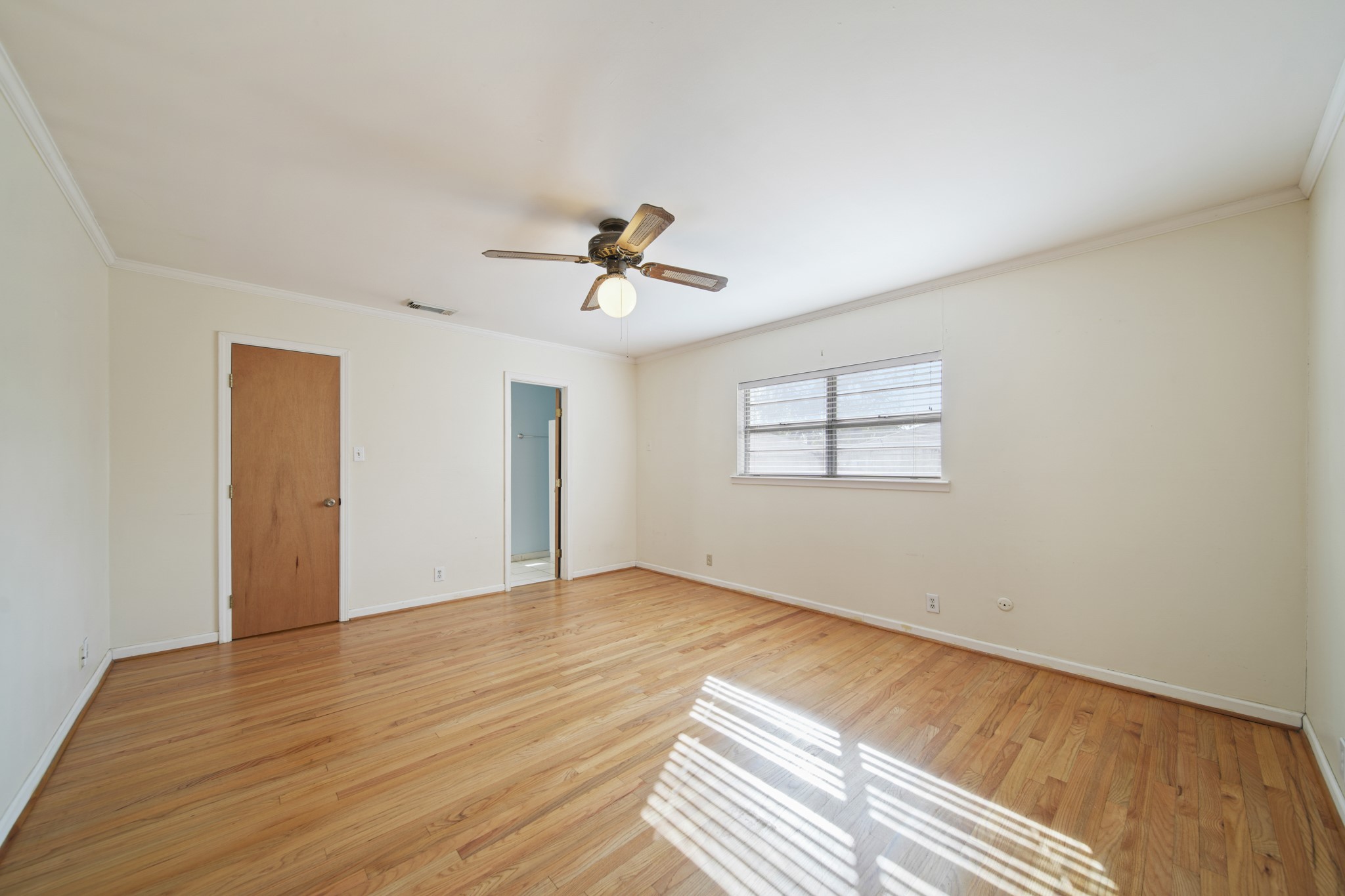1811 Mulcahy Street Rosenberg, TX 77471 - Photo 12 of 25 a view of empty room with wooden floor and fan