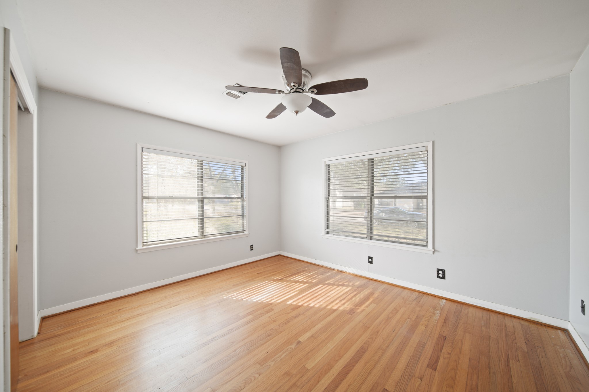 1811 Mulcahy Street Rosenberg, TX 77471 - Photo 17 of 25 a view of empty room with wooden floor and fan