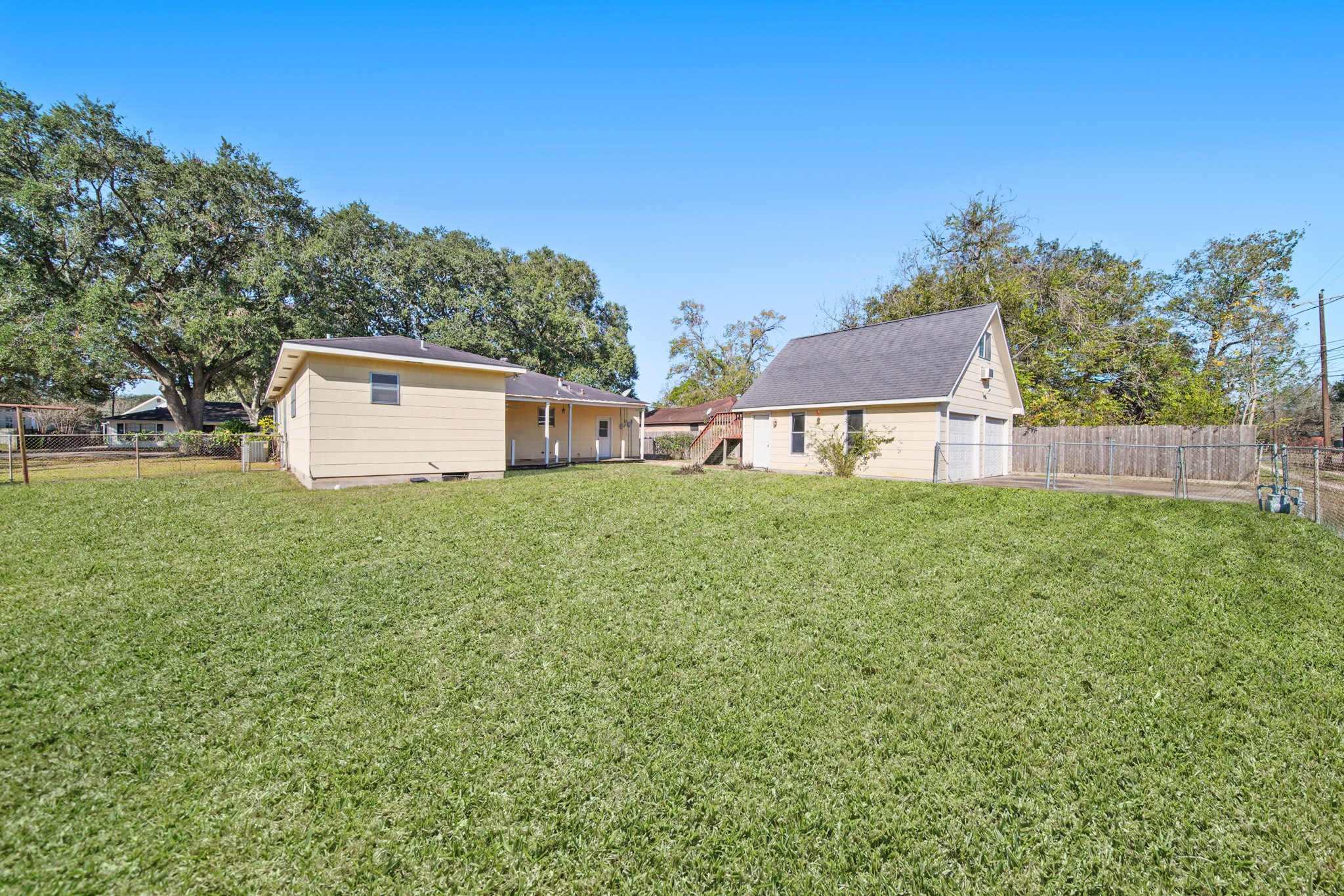 1811 Mulcahy Street Rosenberg, TX 77471 - Photo 22 of 25 a white house that has tree in front of it