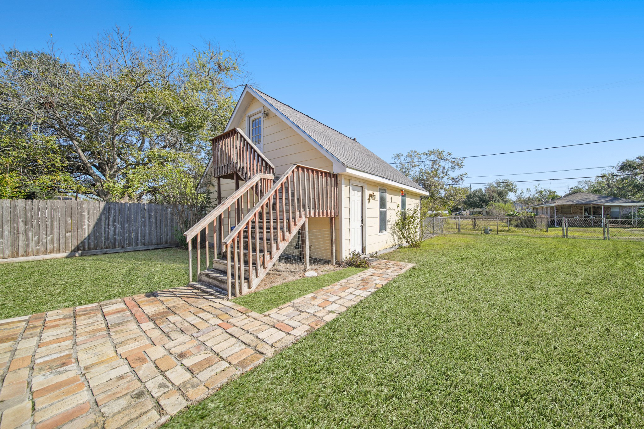 1811 Mulcahy Street Rosenberg, TX 77471 - Photo 23 of 25 a view of a house with backyard and deck