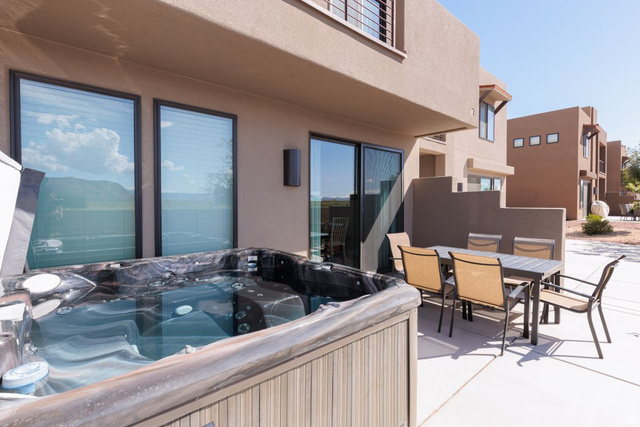 4845 Fishers Is Way St. George, UT 84770 - Photo 28 of 41 View of patio / terrace with outdoor dining space and a hot tub