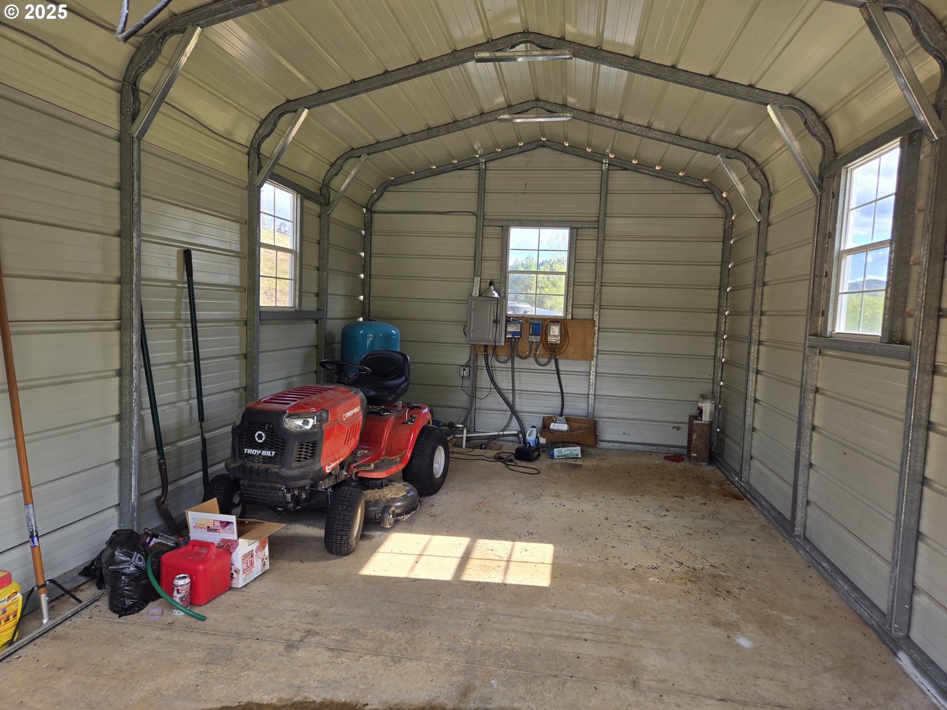 740 Ireland Road Winston, OR 97496 - Photo 12 of 18 a garage with a table and chairs