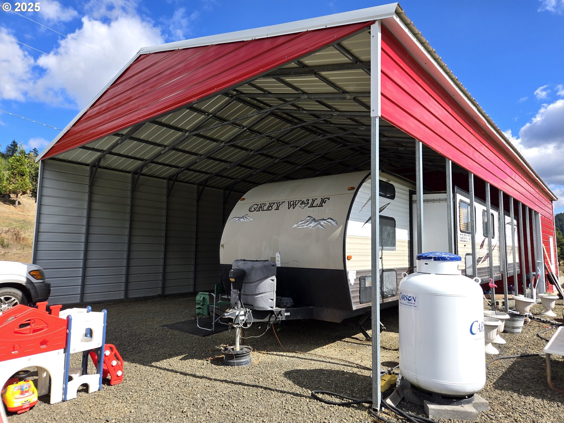740 Ireland Road Winston, OR 97496 - Photo 5 of 18 a front view of a house with patio