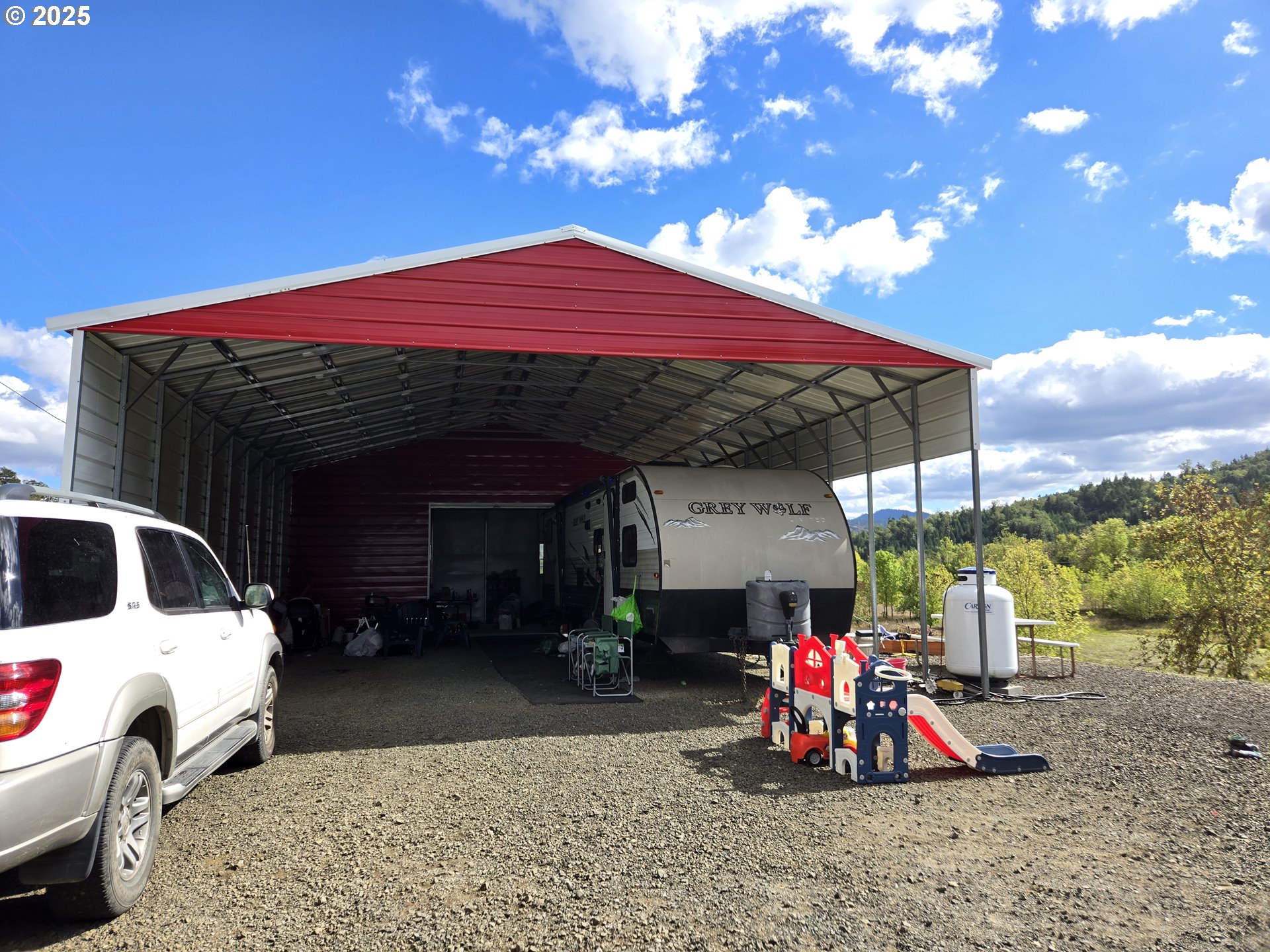 740 Ireland Road Winston, OR 97496 - Photo 6 of 18 a view of a house with a patio