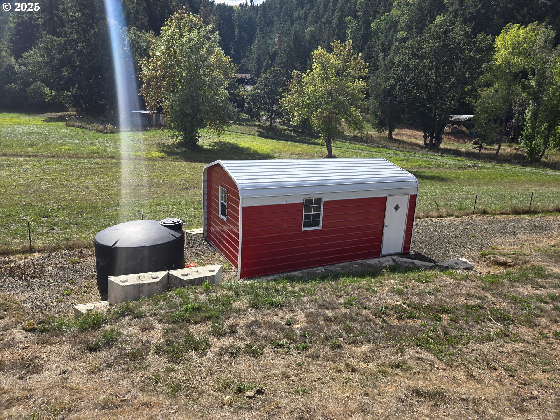 740 Ireland Road Winston, OR 97496 - Photo 10 of 18 a view of a backyard with sitting area