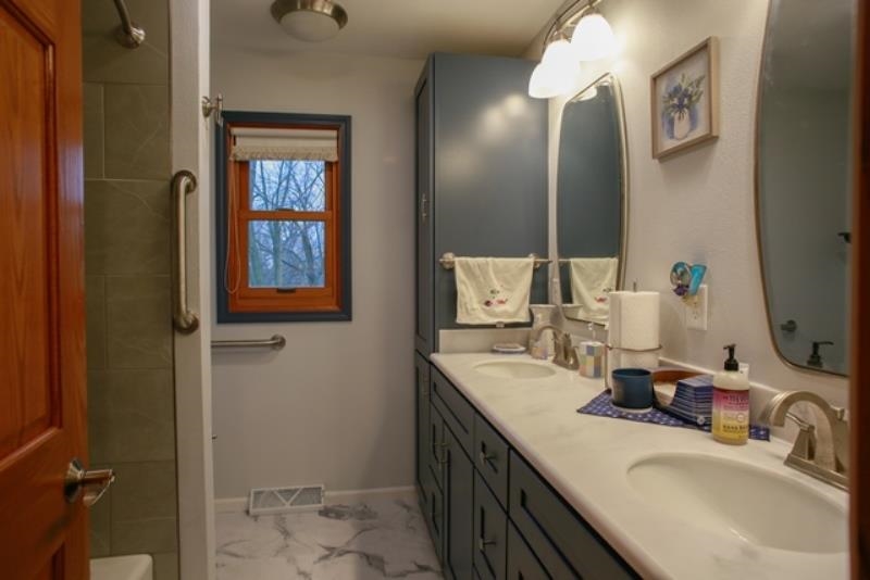 6727 North 5 Corners Road Lena, IL 61048 - Photo 15 of 20 a bathroom with a sink and a mirror