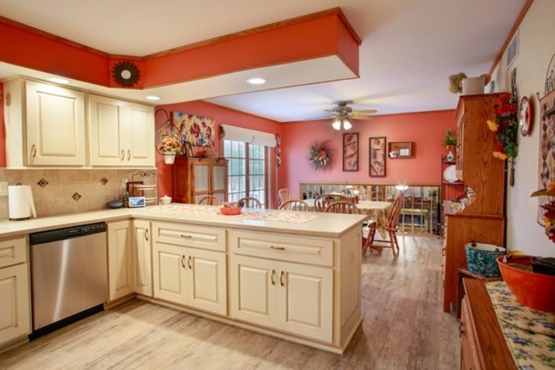 6727 North 5 Corners Road Lena, IL 61048 - Photo 4 of 20 a kitchen with a sink cabinets and wooden floor
