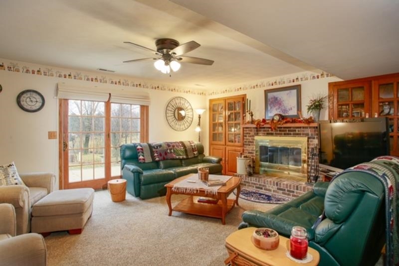 6727 North 5 Corners Road Lena, IL 61048 - Photo 6 of 20 a living room with furniture and a fireplace