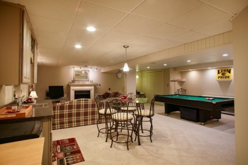 6727 North 5 Corners Road Lena, IL 61048 - Photo 9 of 20 a living room with furniture a rug and kitchen view
