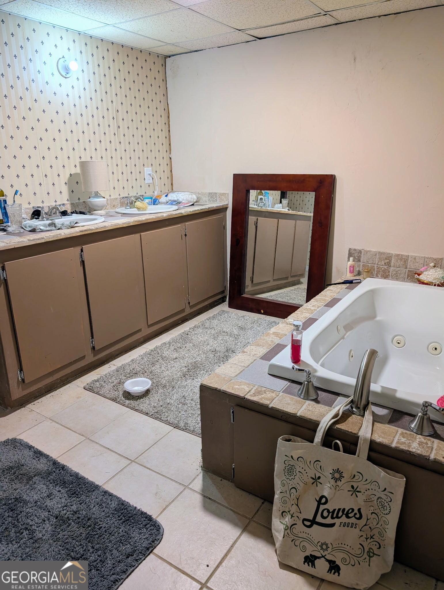 6771 Highway 53 Tate, GA 30177 - Photo 5 of 7 a bathroom with a granite countertop sink and a mirror