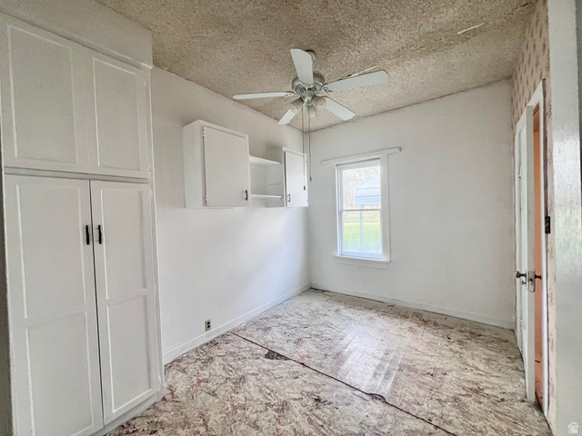 479 East 100 N Road Meadow, UT 84644 - Photo 18 of 59 Unfurnished bedroom with a textured ceiling and a ceiling fan