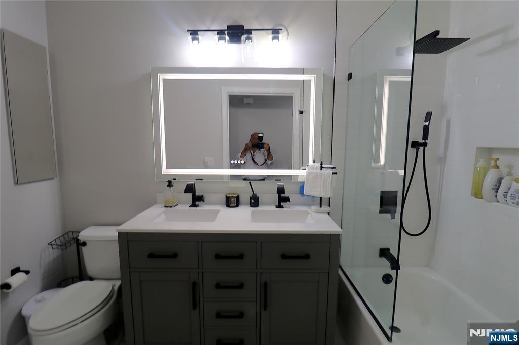 163 Conover Terrace Lebanon, NJ 08833 - Photo 12 of 23 a bathroom with a sink vanity mirror and toilet