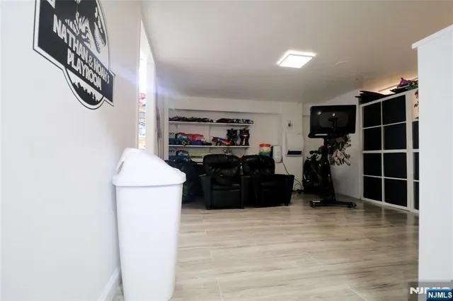 a kitchen with a refrigerator and cabinets