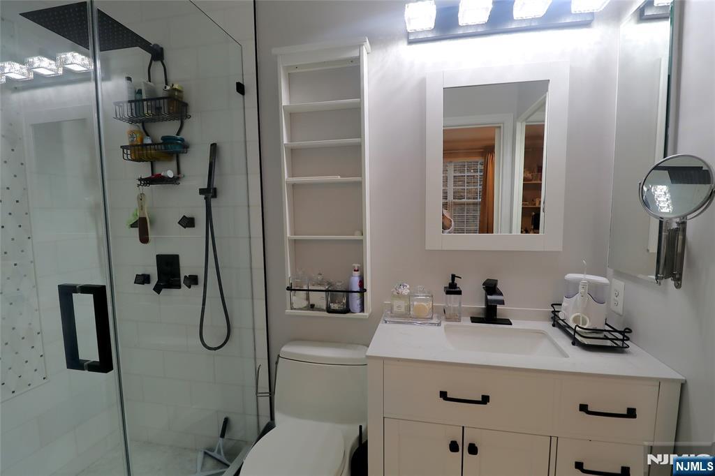 163 Conover Terrace Lebanon, NJ 08833 - Photo 6 of 23 a bathroom with a sink and mirror