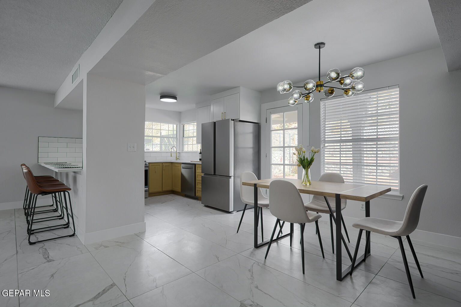 7413 Le Conte Drive El Paso, TX 79912 - Photo 13 of 50 a view of a dining room with furniture and chandelier