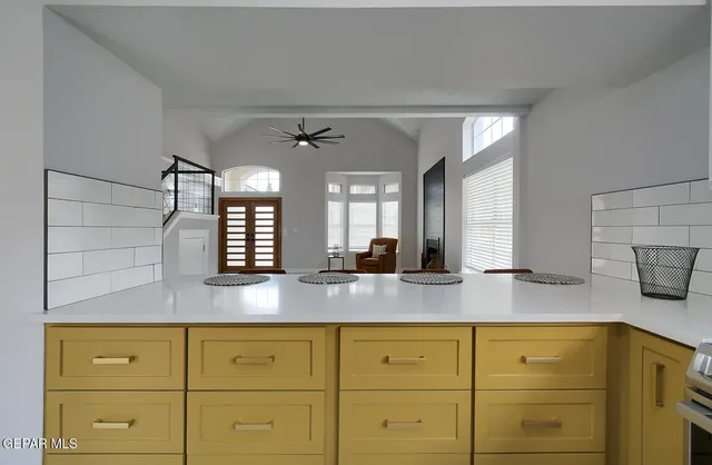a stove top oven sitting inside of a kitchen