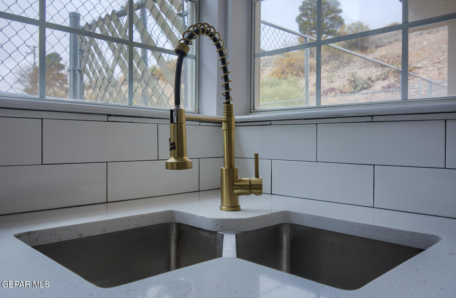 7413 Le Conte Drive El Paso, TX 79912 - Photo 20 of 50 a kitchen with a sink and large window