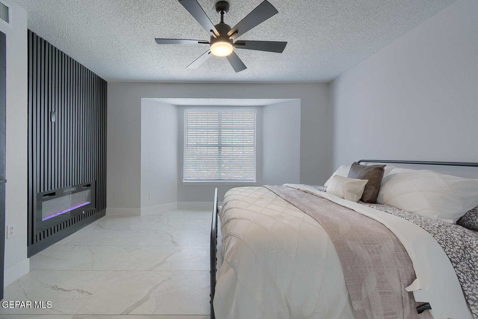 7413 Le Conte Drive El Paso, TX 79912 - Photo 26 of 50 a bedroom with a large bed and a ceiling fan