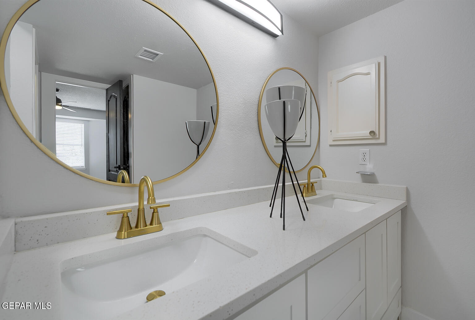 7413 Le Conte Drive El Paso, TX 79912 - Photo 31 of 50 a bathroom with a sink and a mirror