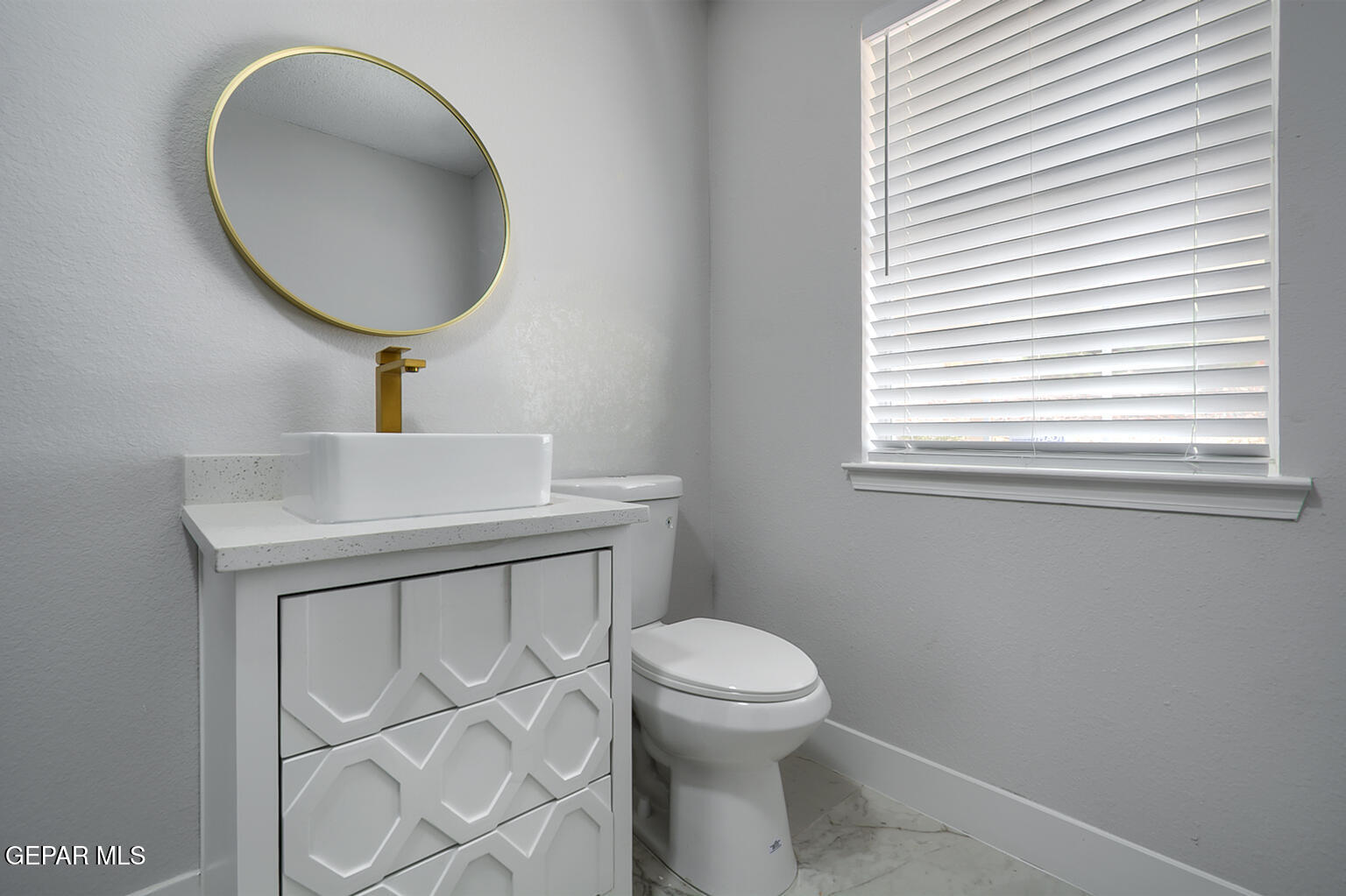 7413 Le Conte Drive El Paso, TX 79912 - Photo 35 of 50 a bathroom with a toilet sink and mirror