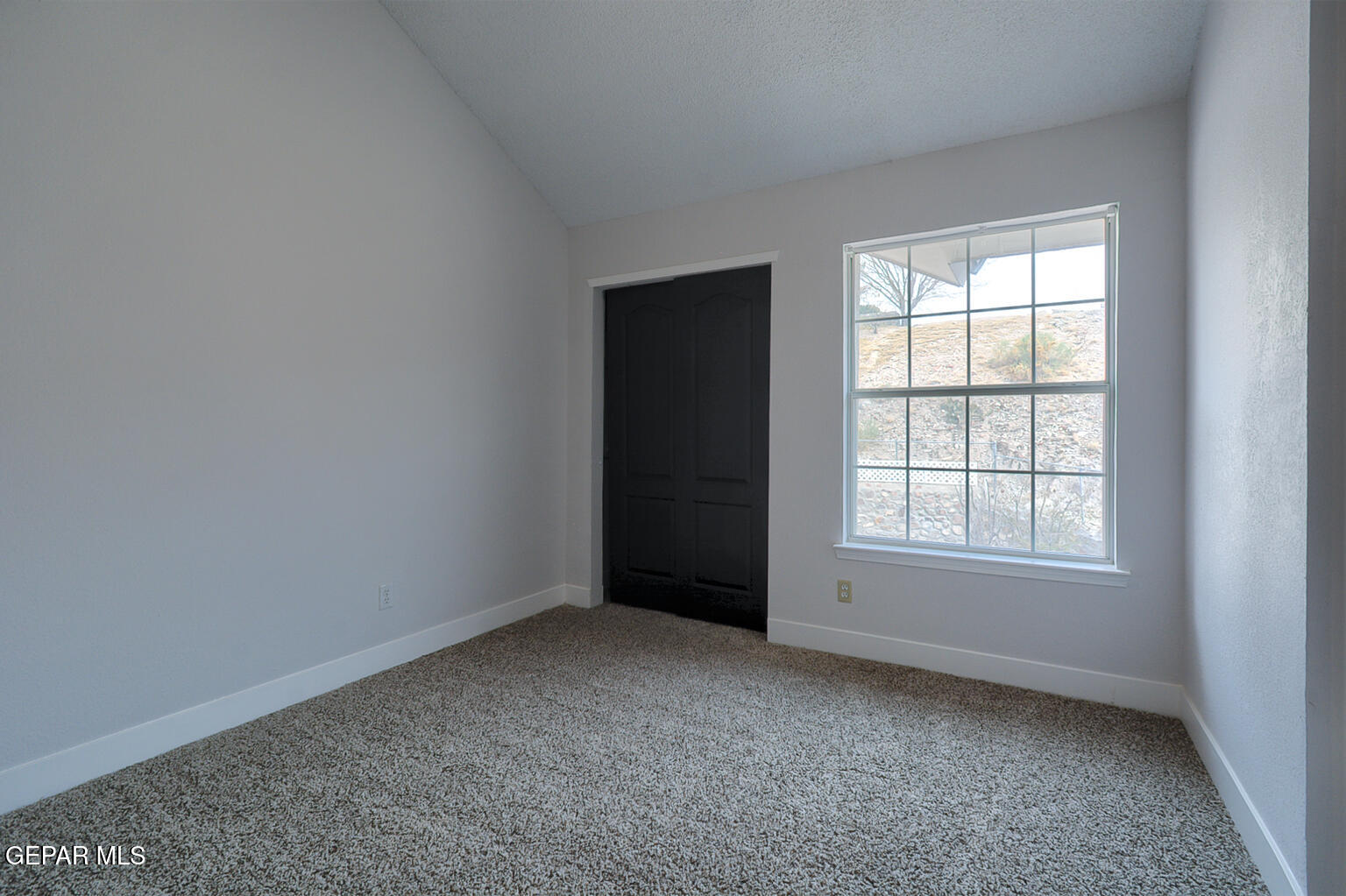 7413 Le Conte Drive El Paso, TX 79912 - Photo 39 of 50 an empty room with a window