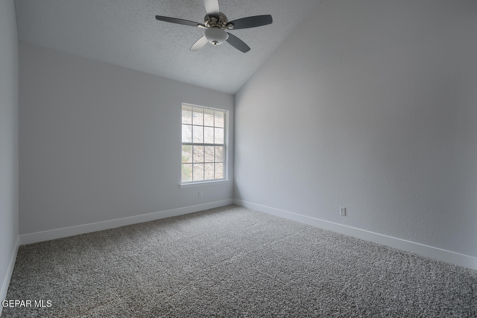 7413 Le Conte Drive El Paso, TX 79912 - Photo 40 of 50 an empty room with a window and a fan