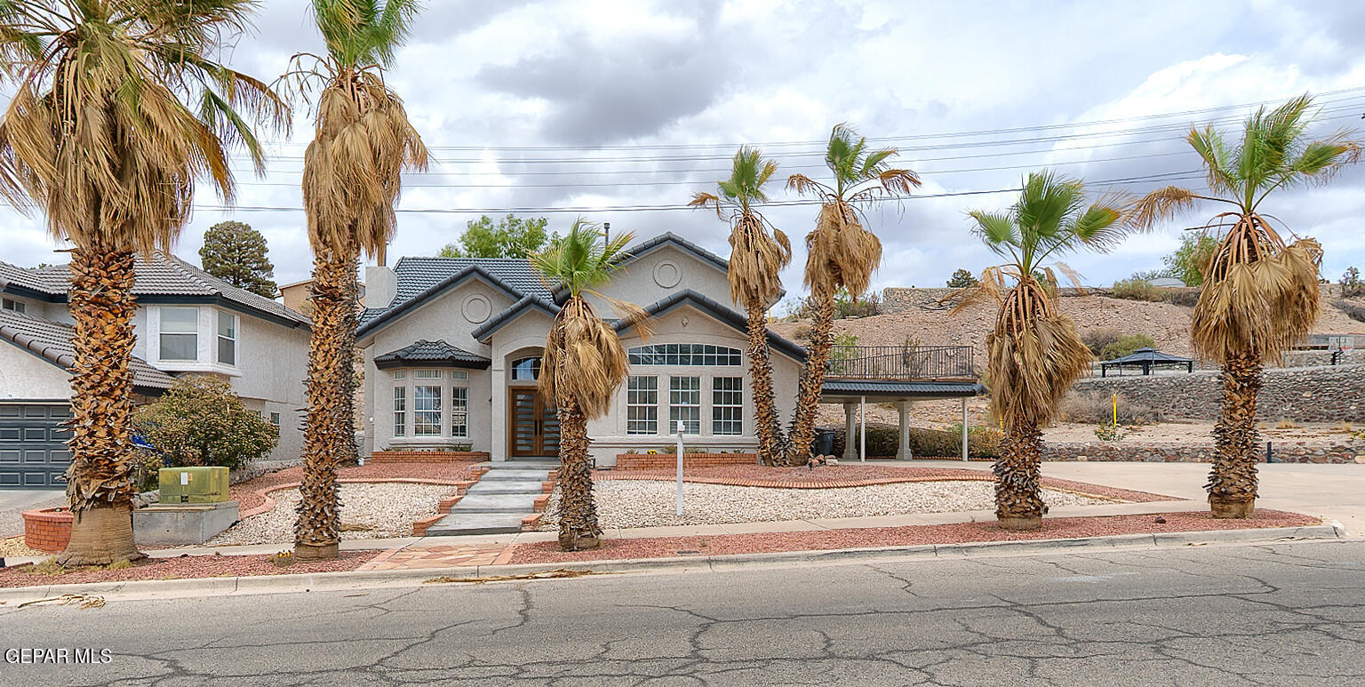 7413 Le Conte Drive El Paso, TX 79912 - Photo 4 of 50 a front view of a house with a tree