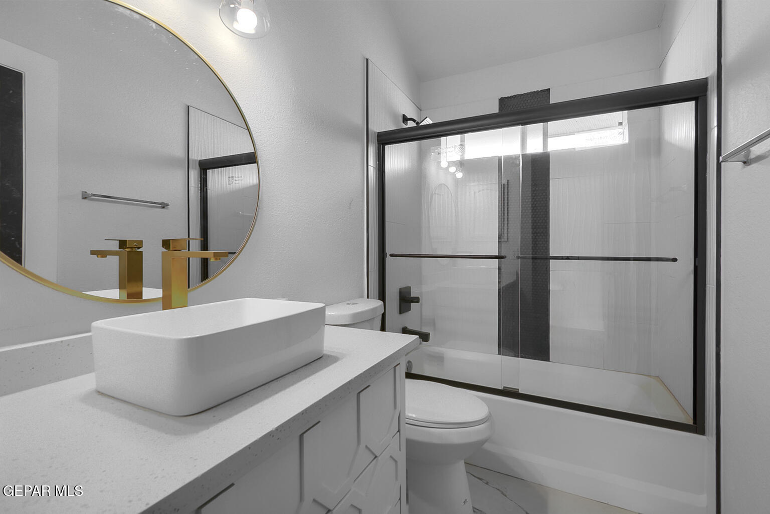 7413 Le Conte Drive El Paso, TX 79912 - Photo 42 of 50 a bathroom with a sink and a mirror