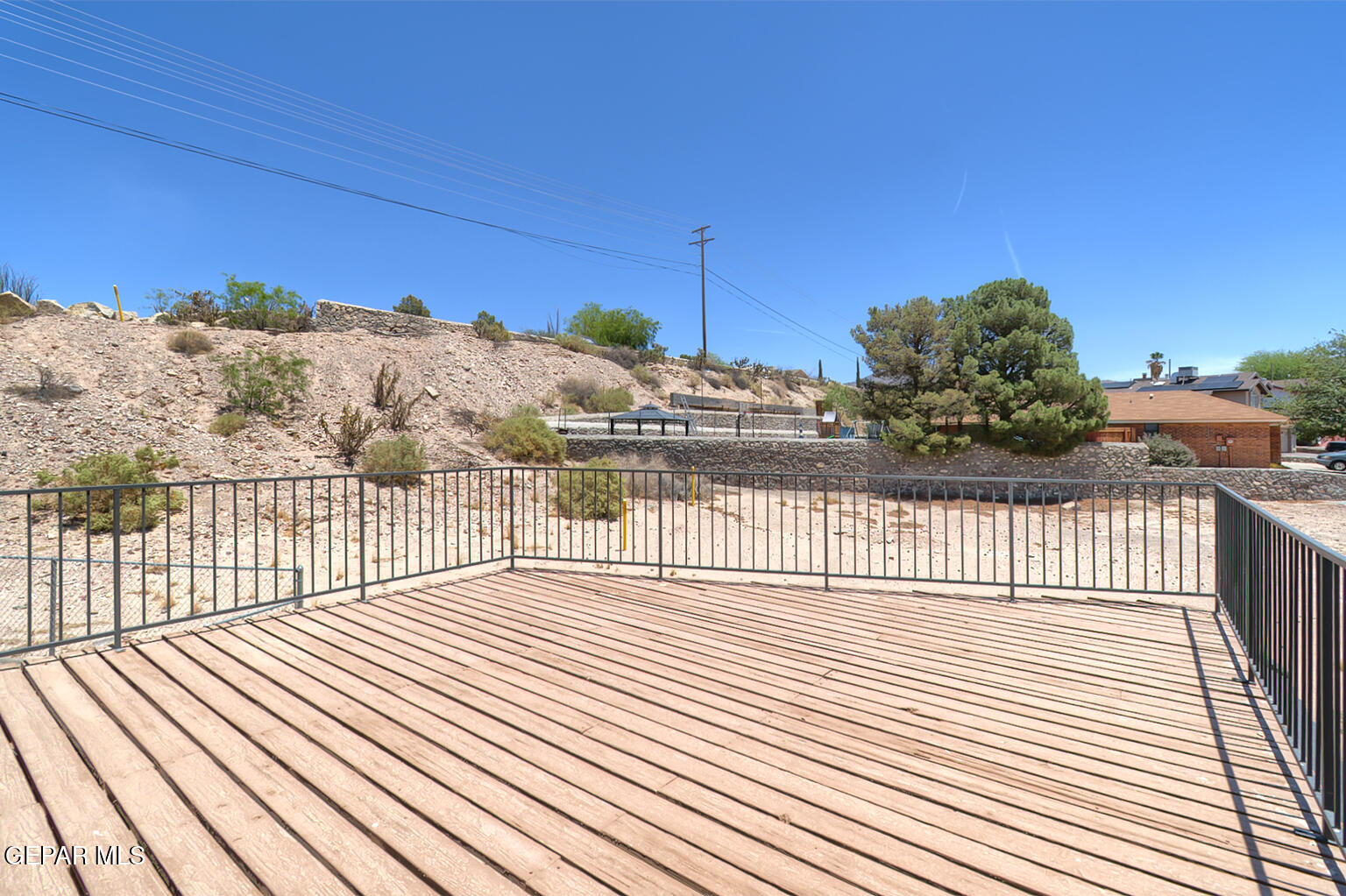 7413 Le Conte Drive El Paso, TX 79912 - Photo 48 of 50 a view of balcony with wooden floor and fence