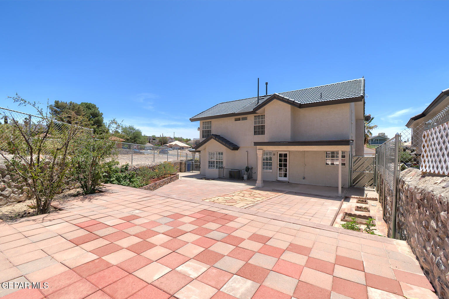 7413 Le Conte Drive El Paso, TX 79912 - Photo 49 of 50 a front view of a house with a yard