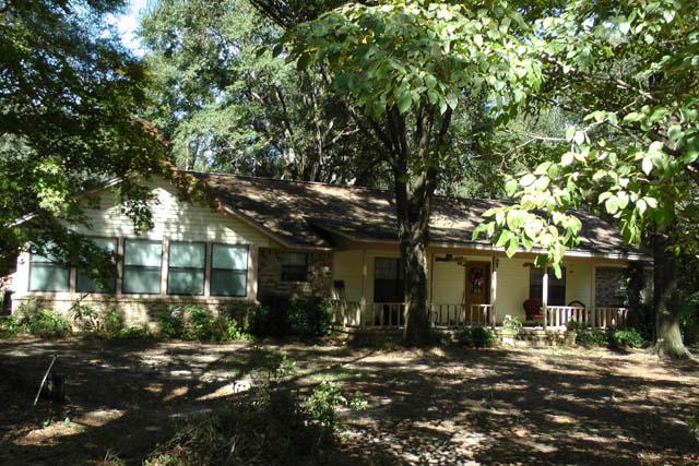 3845 Poverty Creek Road Crestview, FL 32539 - Photo 16 of 32 front view of a house with a tree