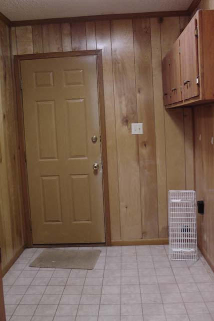 3845 Poverty Creek Road Crestview, FL 32539 - Photo 23 of 32 a view of an entryway with wooden walls