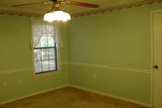 3845 Poverty Creek Road Crestview, FL 32539 - Photo 25 of 32 a view of a room with a chandelier fan and a window